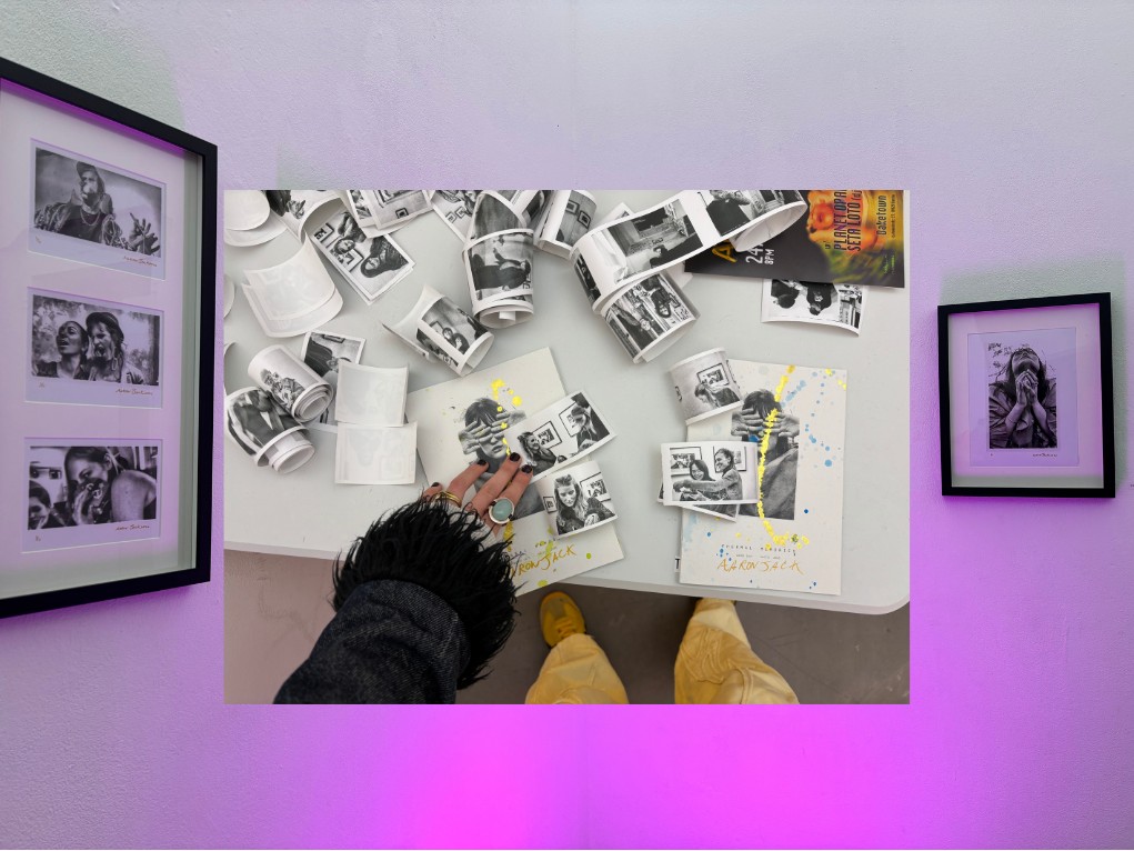 Freshly printed portrait strips on the gallery table