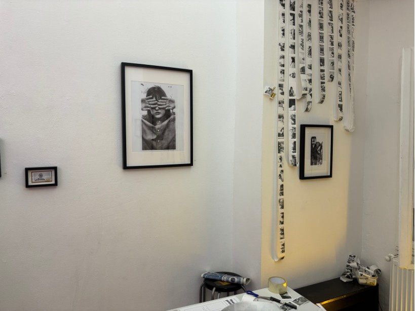 Portraits of visitors on the gallery wall